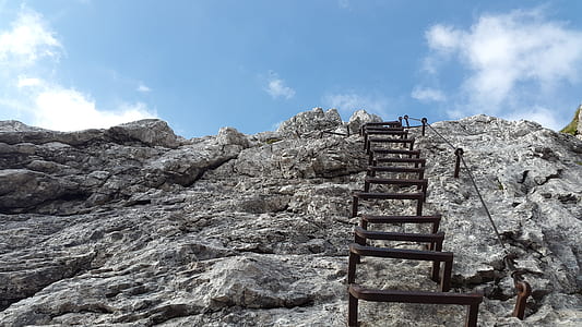 low angle photography of stair on rock formation at daytime thumbnail
