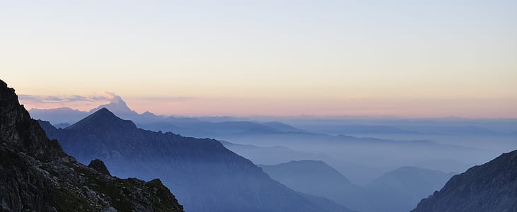aerial photography of mountain during misty golden hour thumbnail
