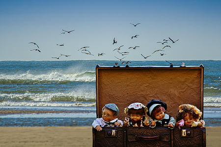 four dolls in chest trunk thumbnail