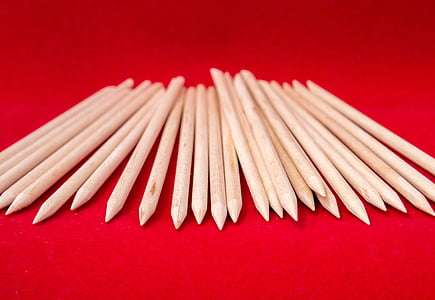 gray sticks on red surface thumbnail