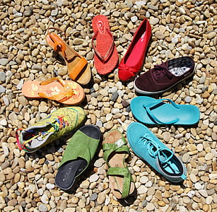 assorted-color of sandal lot in brown rocks thumbnail