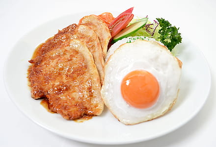 fried pork cutlet with fried egg on plate thumbnail
