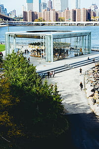 group of people near multicolored carousel thumbnail