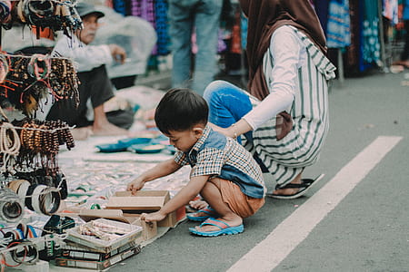 boy holding brown box thumbnail