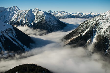 snow covered mountain with fogs thumbnail