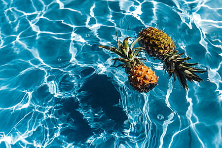 Pineapple in a swimming pool thumbnail