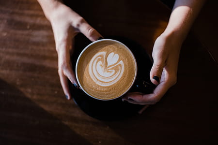 person holding mug thumbnail
