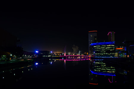 reflection photography of buildings on river thumbnail
