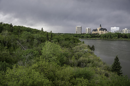 Dark Skies over the trees and skyline of Sasktoon thumbnail