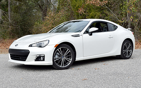 parked white Toyota GT86 coupe on paved road near trees at daytime thumbnail