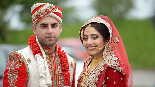 woman in red and white wedding sari dress thumbnail