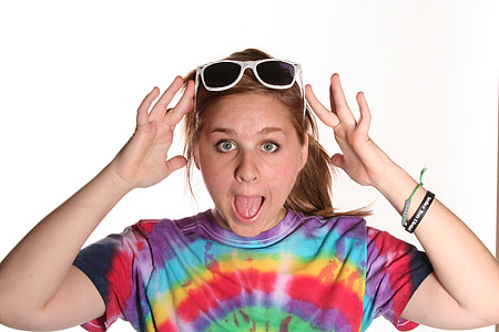 woman holding sunglasses on head with tongue out thumbnail