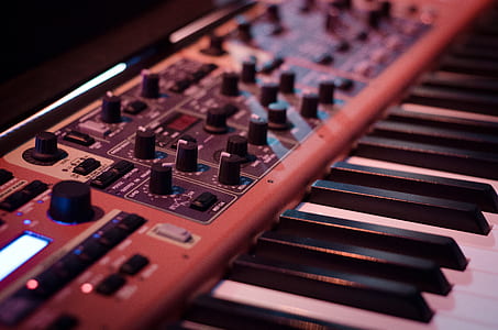 brown and white electronic keyboard thumbnail