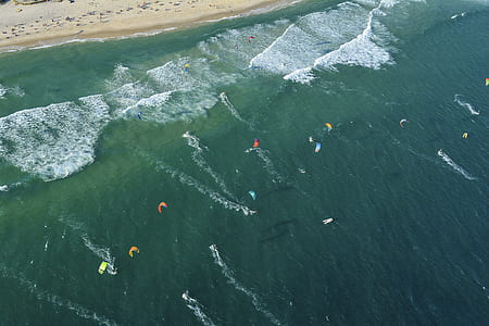 people paragliding above sea thumbnail