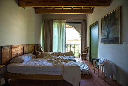 person lying on bed during daytime thumbnail
