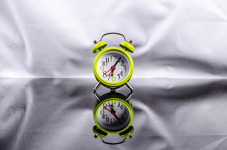 green and white analog alarm clock thumbnail