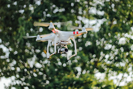selective focus photography of DJI Phantom 3 Standard drone on air thumbnail