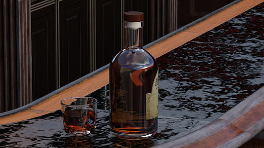 white labeled beverage bottle beside filled with red liquid beside rocks glass with red liquid on black surface thumbnail