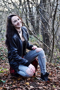 woman wearing black zip-up jacket and blue jeans thumbnail