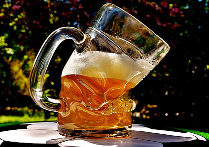 clear glass beer mug filled with beer thumbnail