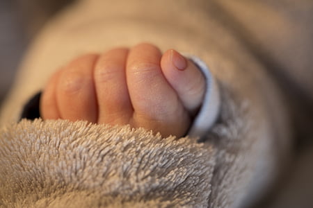 shallow photography of baby's hand thumbnail