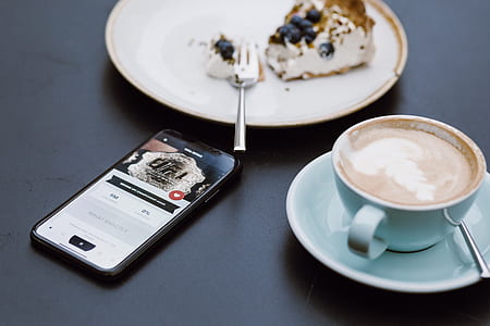 cake on round white ceramic plate beside teacup and saucer thumbnail