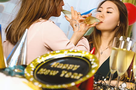 Two young girls celebrate. Happy New Year thumbnail
