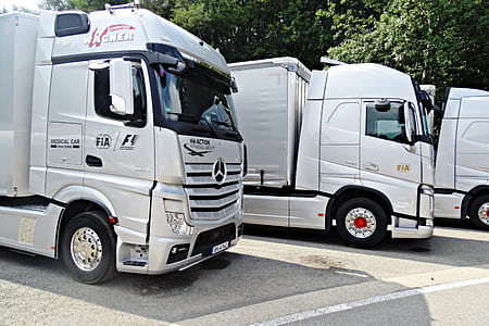 three gray freight trucks thumbnail
