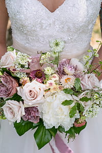 Woman Holding Bouquet of Flowers thumbnail