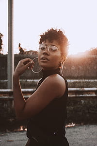 woman wearing sunglasses and hoop earrings thumbnail