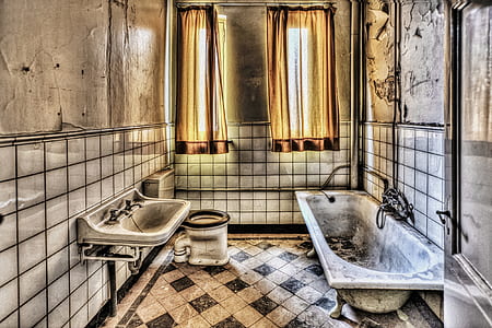 white enamel bathtub near sink thumbnail