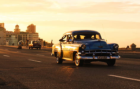classic black coupe on concrete road thumbnail