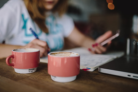 Young woman working in a cafe thumbnail