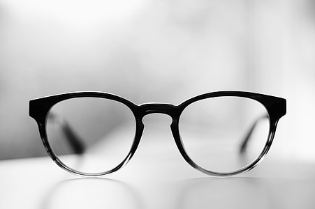 selective focus photography of black framed eyeglasses thumbnail
