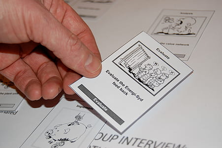 person Holding evaluate card thumbnail