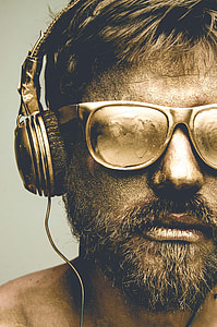 photography of man wearing sunglasses with headphones thumbnail