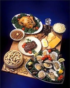 peanuts with clams, cheese, steak and roasted chicken all served in wooden tray thumbnail