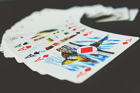 fan of playing card on black surface thumbnail