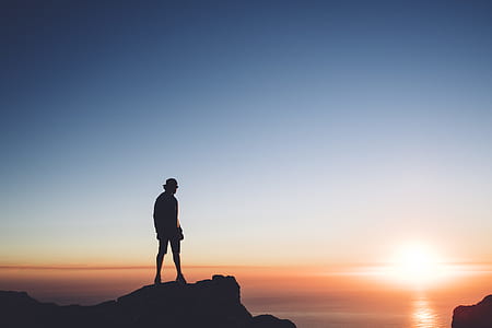 man on top of mountain thumbnail