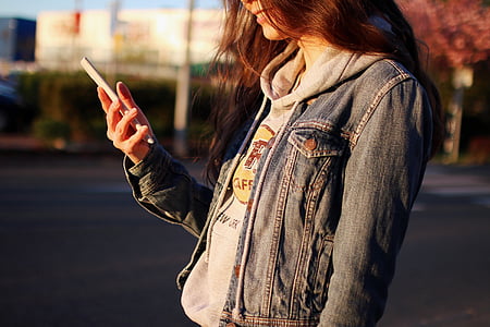 woman wearing grey denim jacket thumbnail