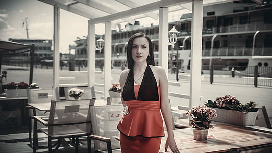 woman wearing red and black halter dress during daytime thumbnail
