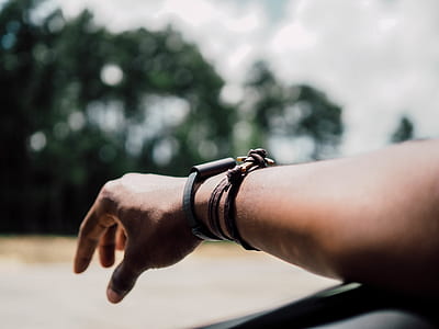 person wearing brown leather bracelet thumbnail