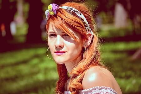 woman wearing white and purple headband selective focus photography during daytime thumbnail