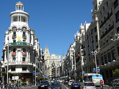 white building road and cars during daytime thumbnail