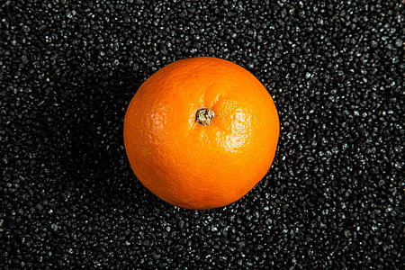 orange fruit on black marble top thumbnail
