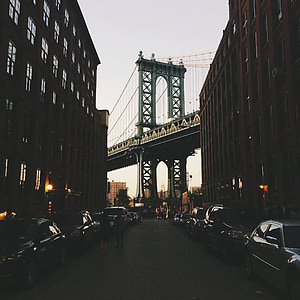 people walking on street between two buildings thumbnail