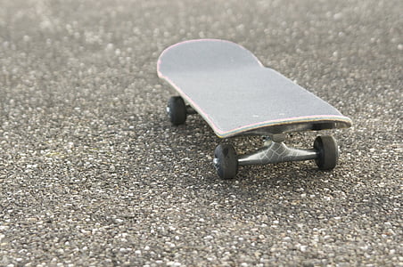 black skateboard on concrete surface thumbnail