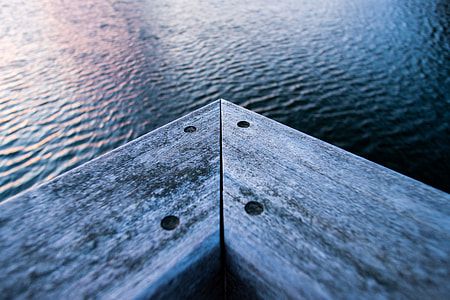 gray wooden corner near body of water thumbnail
