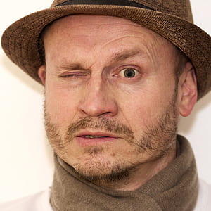 man wearing brown fedora hat thumbnail