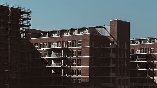 photo of brown buildings during daytime thumbnail